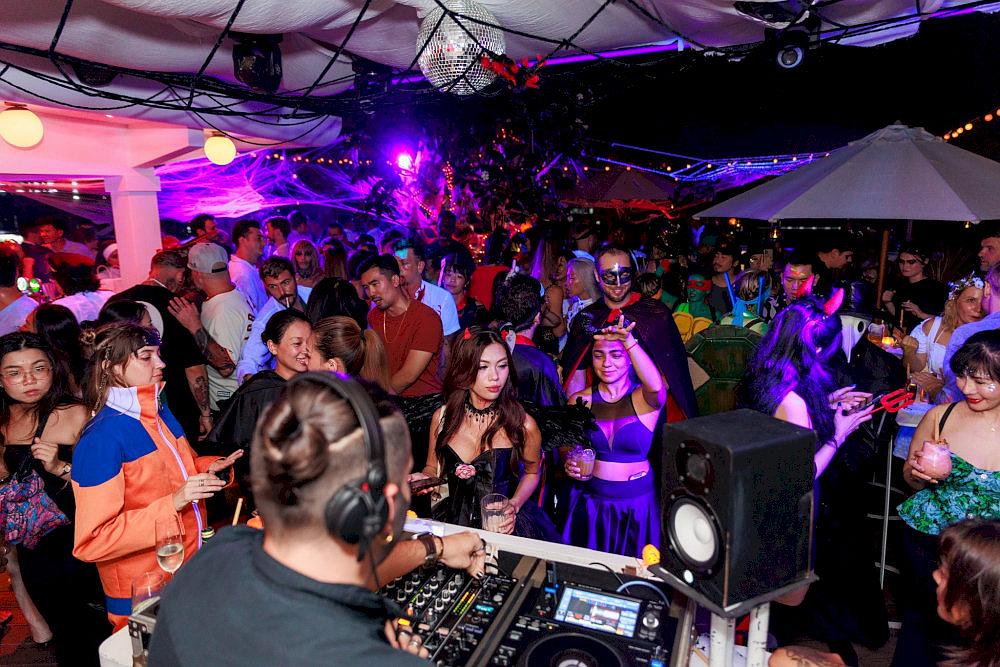 High-energy DJ sets with dancers light up the main stage, pulsing with funky and disco rhythms all night